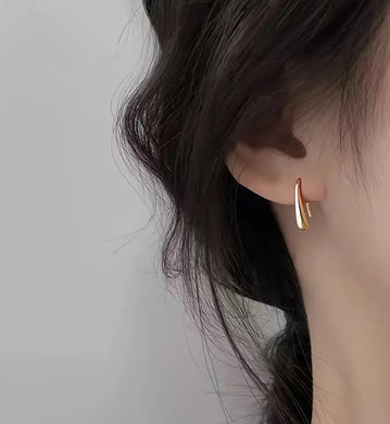 154. Tiny golden water droplet earrings