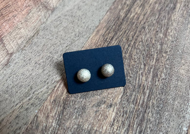 221. Pitted golden ball stud earrings