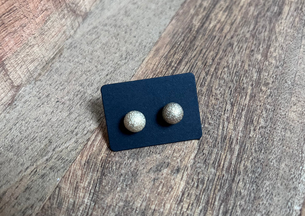 221. Pitted golden ball stud earrings